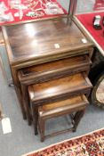 A good nest of four Chinese hardwood tables.