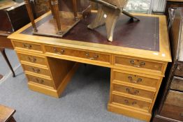 A large oak twin pedestal desk.