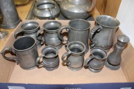 Pewter measures, tankards and other items.