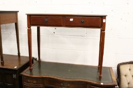 A mahogany two drawer side table.
