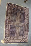 A small blue ground Persian prayer rug.