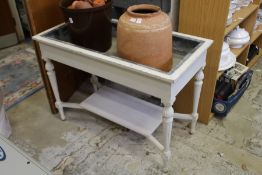 A white painted, zinc lined jardiniere / plant trough.