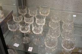 A quantity of wine and brandy glasses.