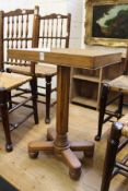 An unusual oak pedestal table with dished top.