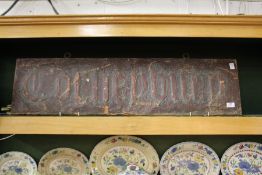 A copper double sided hanging sign.