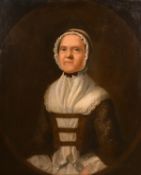 An 18th century half-length portrait of a lady in a lace headdress, possibly American, oil on