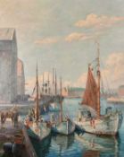 Robert Panitzsch (1879-1949) Danish, fishing boats moored on a quay with a city beyond, probably