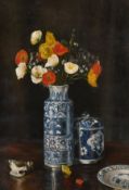 Late 19th/early 20th century school, A still life of flowers, in a blue and white oriental vase, oil