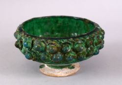 A GOOD KASHAN MOULDED GREEN GLAZED POTTERY BOWL, 14CM.