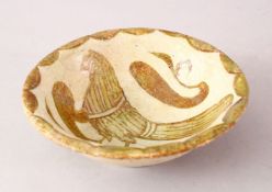 A GOOD ISLAMIC ABBASID POTTERY BOWL, with a light glaze decorated with birds, 14cm.