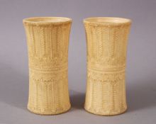 A PAIR OF 18TH CENTURY SRI LANKAN IVORY DICE SHAKERS, with finely carved palmette decoration, 10.5cm