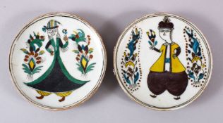 TO TURKISH KUTAHYA POTTERY FIGURAL DISHES, each decorated with a figure and floral motif, 14cm (2)