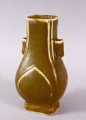 A CHINESE TEA DUST GLAZED PORCELAIN TWIN HANDLE VASE, the body with a graduating tea glaze, with