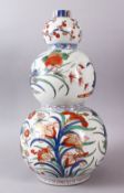 A 18TH / 19TH CENTURY CHINESE FAMILLE VERTE TRIPLE GOURD PORCELAIN VASE, decorated with an array