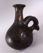 A GOOD EARLY AMLASH RYTON 1000BC POTTERY RAMS HEAD VASE, with a moulded base with a rams head