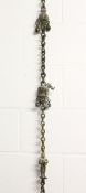 A LARGE 19TH CENTURY INDIAN HEAVY BRASS CHAIN mounted with figures and ornaments, overall length