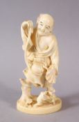 A JAPANESE MEIJI PERIOD CARVED IVORY OIMONO - FROG CATCHER - the man stood in a charming pose with