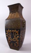 A CHINESE ARCHAIC STYLE PORCELAIN TWIN HANDLE VASE, with moulded twin handles of lion dogs and