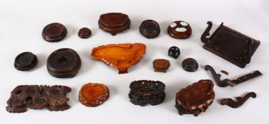 A MIXED LOT OF 17 CHINESE CARVED WOODEN STANDS, of varying timber, style and sizes.