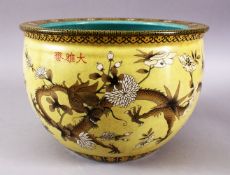 A LATE 19TH / EARLY 20TH CENTURY CHINESE YELLOW GROUND POLYCHROME DRAGON DECORATED JARDINIERE, the
