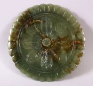 A CHINESE CARVED JADE FLOWER FORMED DISH, with a gilt ring interior, 18cm