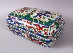 A CHINESE WUCAI DECORATED PORCELAIN DRAGON BOX & COVER, depicting dragons chasing the pearl