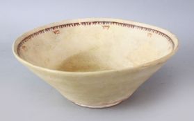 AN IRANIAN NISHABOUR POTTERY BOWL WITH CALLIGRAPHY, the inner decorated with calligraphy, 24cm.