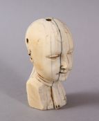AN 18TH CENTURY CARVED IVORY GOA HEAD, the head bearing a mediative expression, 8cm.