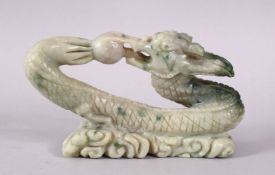 A CHINESE CARVED SOAPSTONE FIGURE OF A DRAGON & PEARL, the dragon intertwined chasing the pearl
