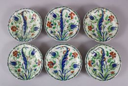 A SET OF SIX 19TH CENTURY IZNIK STYLE CANTAGALLI PLATES, painted with flowers and leaves, mark to