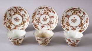 THREE JAPANESE MEIJI PERIOD ARITA PORCELAIN CUP & SAUCERS, with filt and orange floral decoration,