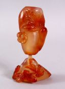 TWO CHINESE CARVED AGATE SNUFF BOTTLES, One carved with funghi, 6cm the larger carved with gourd