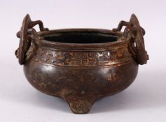 A CHINESE BRONZE TWIN DRAGON HANDLE INCENSE BURNER, the body with two elevated molded dragon