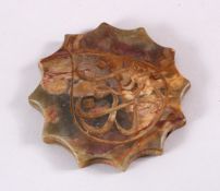 AN ISLAMIC CARVED HARDSTONE SUFI TELSIMTASI 12 IMAMS, in carved star form with calligraphy. 3.5cm