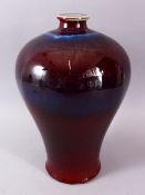 A GOOD CHINESE FLAMBE PORCELAIN VASE, with a graduating red / blue ground, crackle glaze base, 33cm