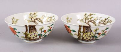 A PAIR OF CHINESE FAMILLE ROSE PORCELAIN RICE BOWLS, decorated with blossom trees decoration, the