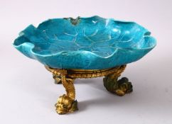 A CHINESE TURQUOISE GLAZED LILLY PAD FORMED POTTERY DISH & ORMOLU STAND, the dish in the form of a