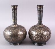 A PAIR OF 18TH/19TH CENTURY INDIAN BIDRI SILVER INLAID BOTTLES, 26cm high.