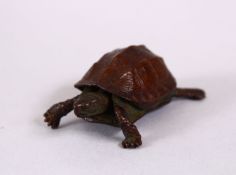 A JAPANESE BRONZE FIGURE OF A TORTOISE, signed to belly, 4.5cm.