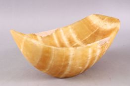 A CARVED MARBLE BOWL, with white inclusions among the yellowing marble, 27cm (AF)