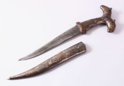 A 19TH CENTURY INDIAN SILVER OVERLAID DAGGER, with twin beast handles, with formal motif decoration,
