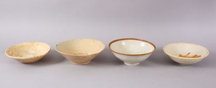 FOUR EARLY CHINESE POTTERY BOWLS, 17.5cm down to 15.5cm.