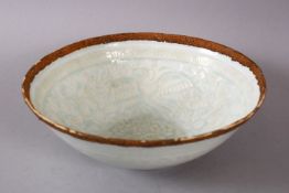 A CHINESE CELADON EGG SHELL PORCELAIN BOW, carved with lotus and birds, 18.5cm