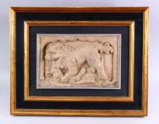 A CHINESE SANDSTONE RELIEF PANEL depicting a Buddhistic lion, framed, 20cms x 31cms.