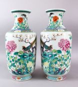 A LARGE PAIR OF CHINESE FAMILLE ROSE PORCELAIN VASES, each decorated with scenes of birds amongst