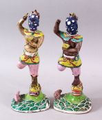 A PAIR OF 19TH CENTURY CHINESE FAMILLE ROSE PORCELAIN GHOST OF QUIXING FIGURES, both stood upon lion