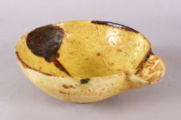 A GOOD IRAN STYLE POTTERY POURING BOWL, decorated with a yellow ground with brown splash decoration,