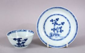 A 19TH CENTURY CHINESE NANKING CARGO BLUE & WHITE PORCELAIN CUP & SAUCER - decorated with a native