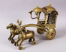 AN 18TH CENTURY INDIAN BRASS CHILDS TOY CHARIOT, 32cm long.