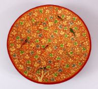 A FINE 19TH CENTURY INDIAN KASHMIRI LACQUERED PAPIER-MACHE DISH, painted with birds amongst native
